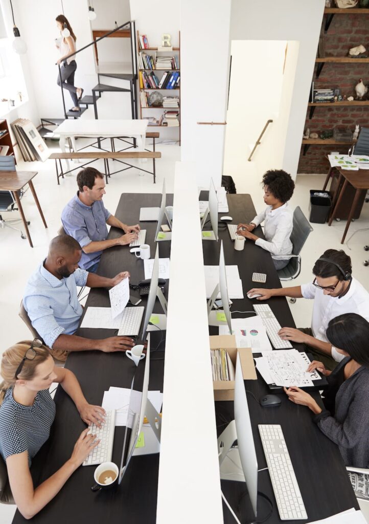 Colleagues at a busy open-plan office